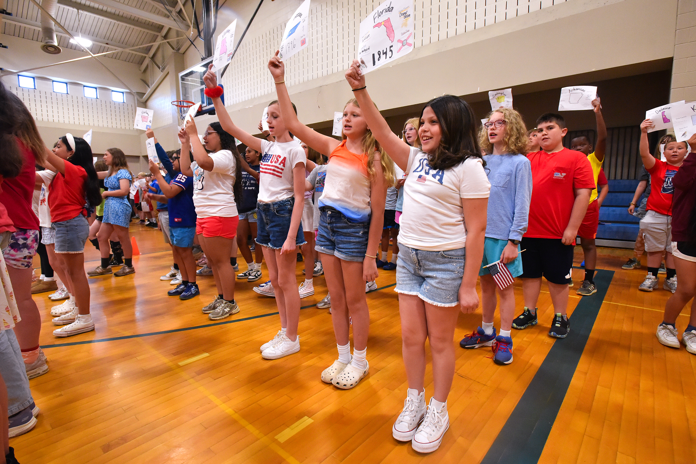 Fifth grade students sing “Nifty Fifty United States” during an...
