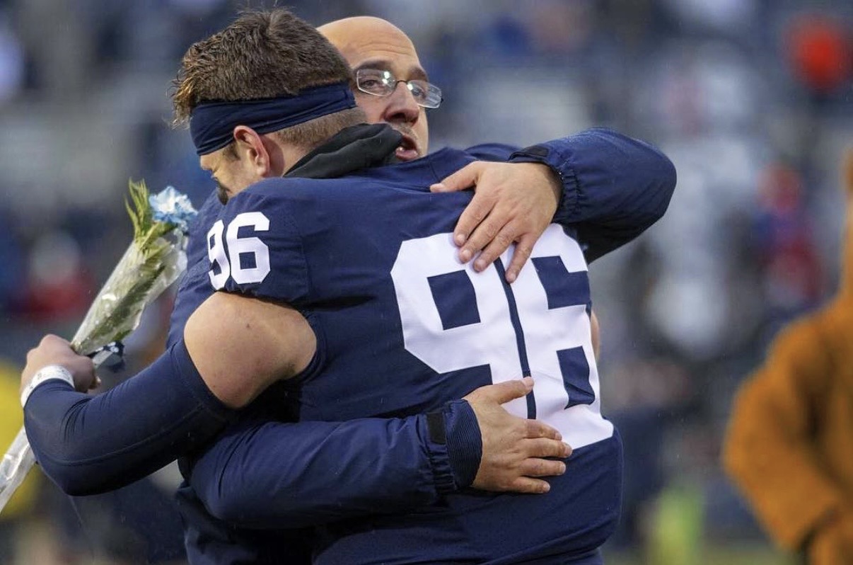 Penn State head coach James Franklin embraces Kyle Vasey during...