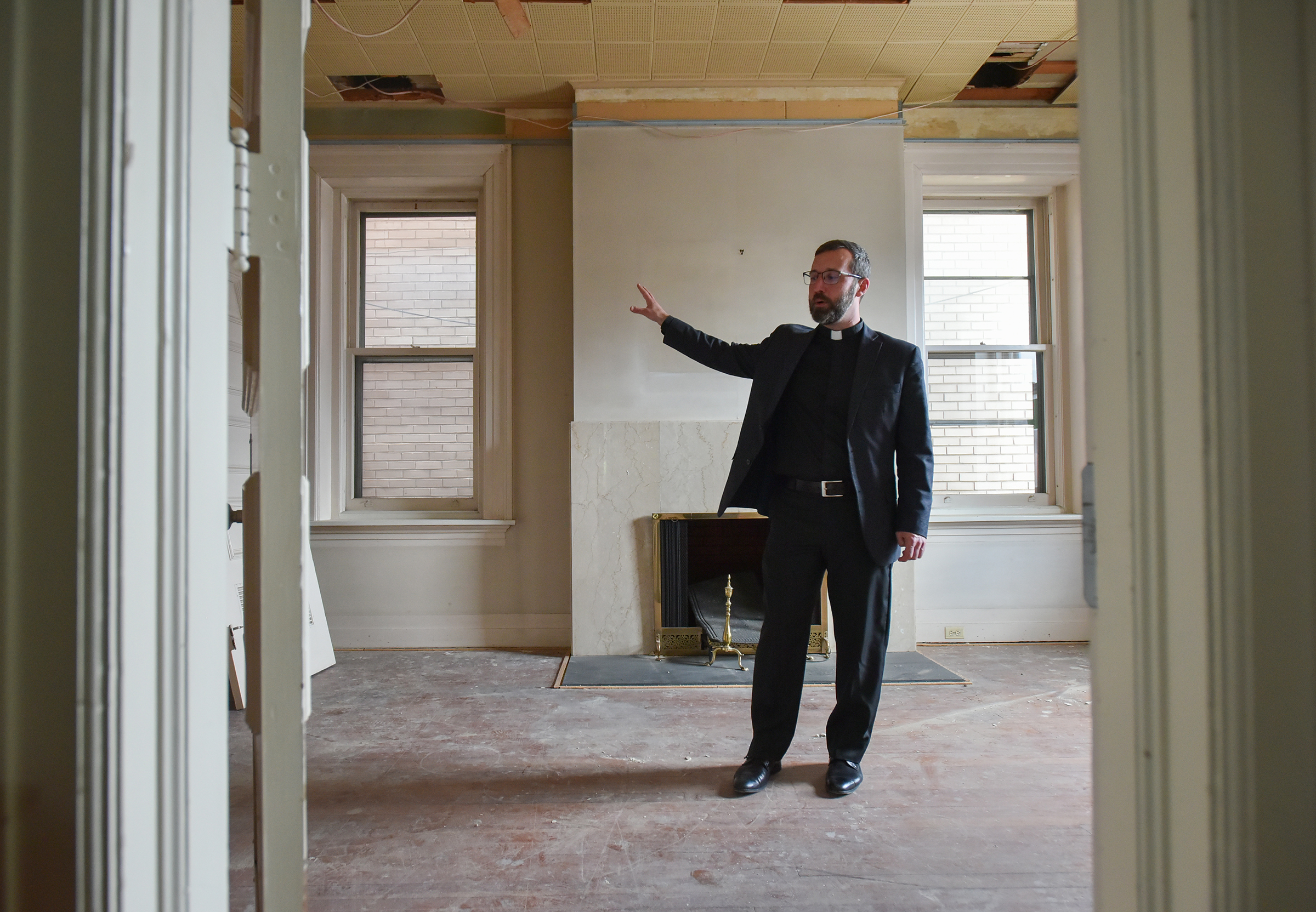 Rev. Alex Roche talks about the library inside of the...