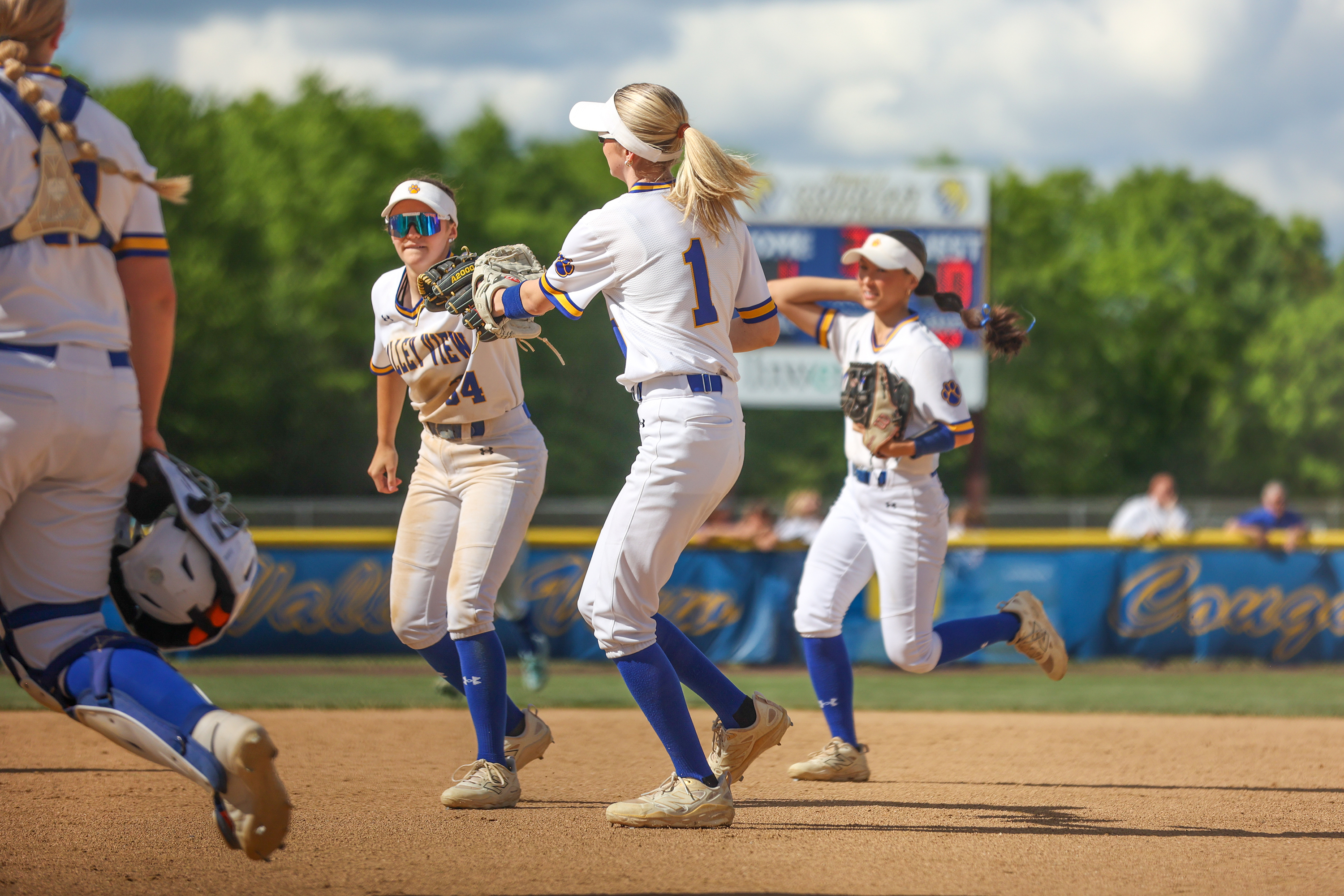 Valley View infielders Cora Castellani (34) and Nevaeh Evans (1)...