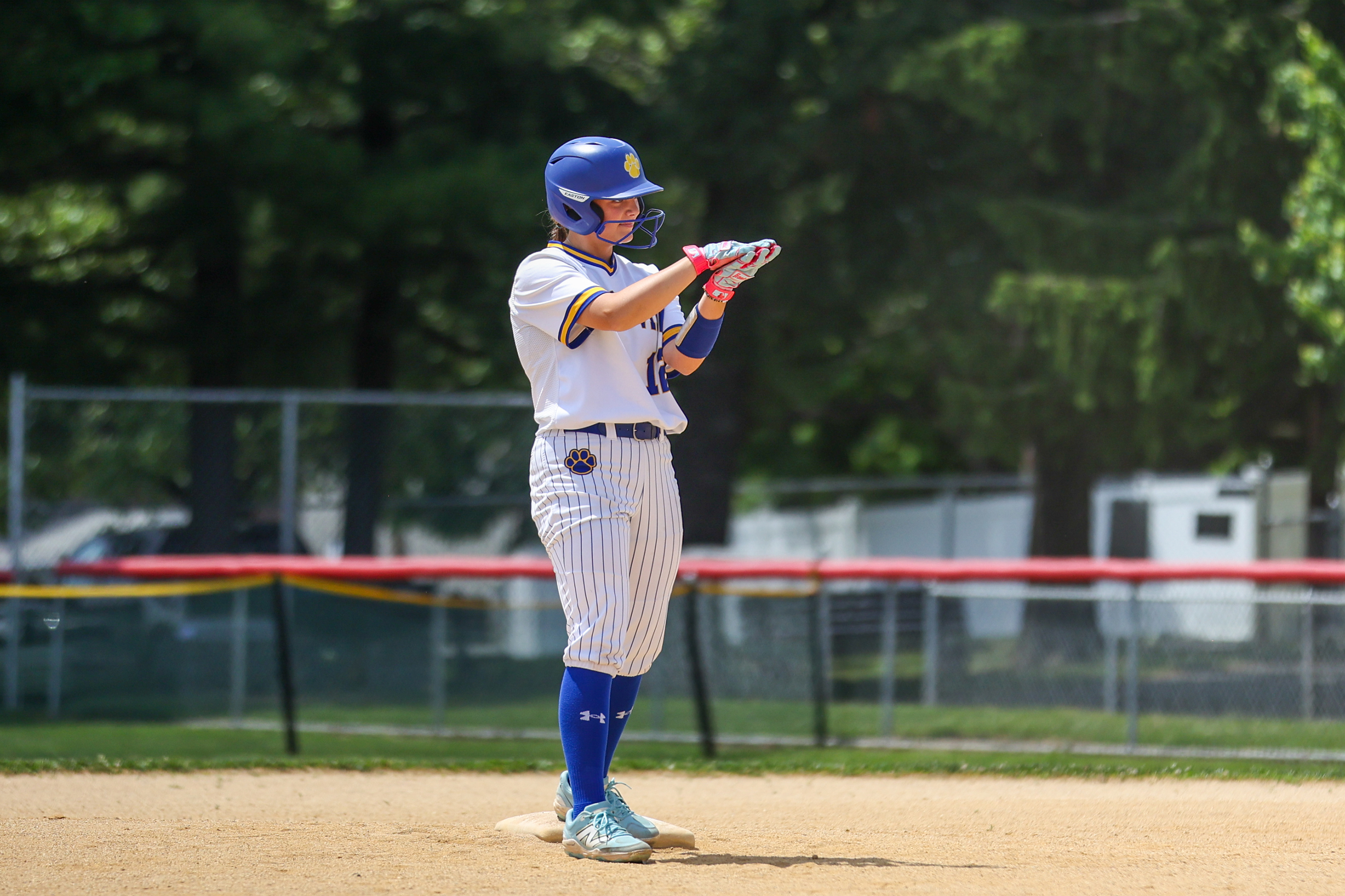 Valley View’s Zoie Krupovich (12) claps after hitting a double...