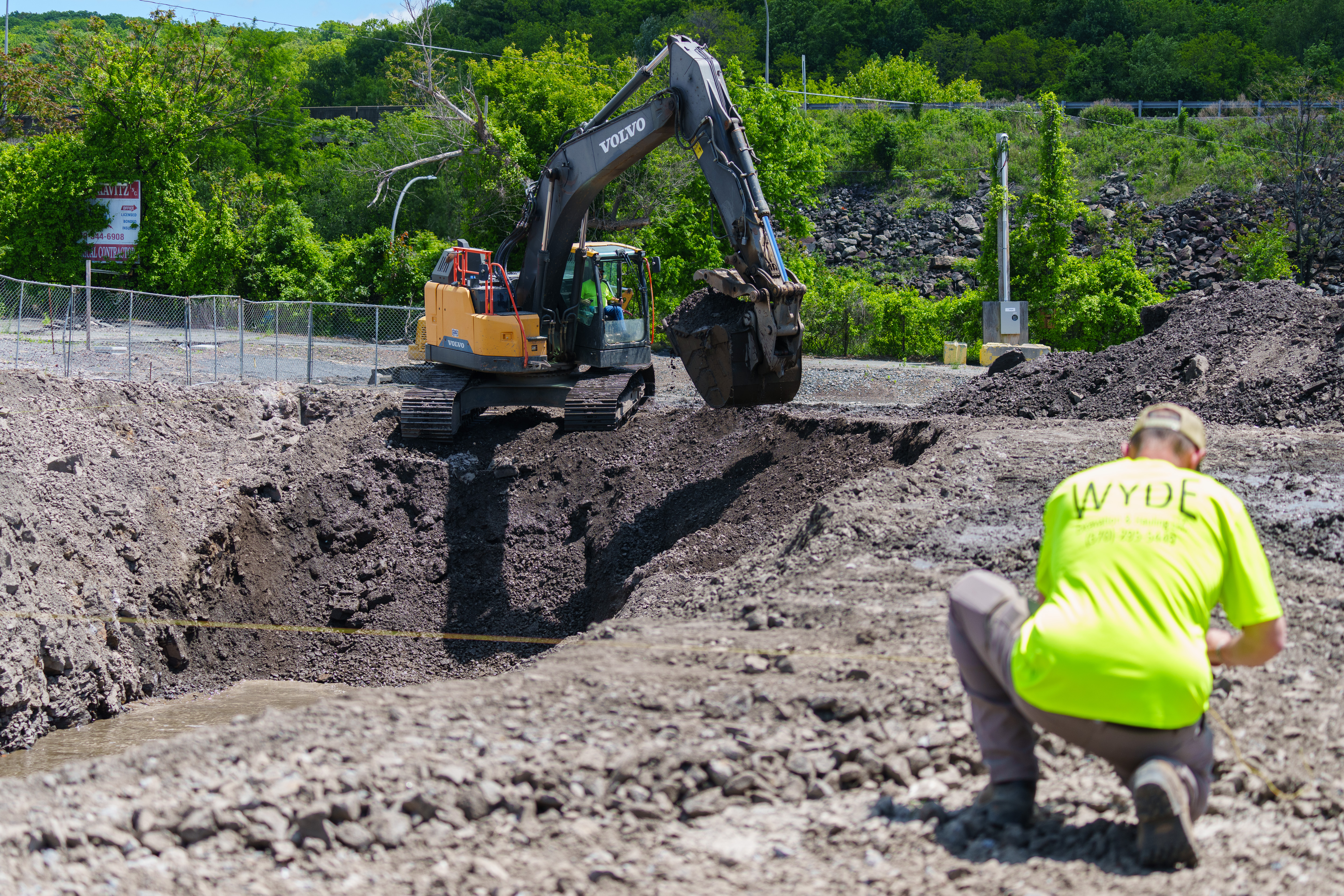 An excavator digs Monday at the site of a Wawa...