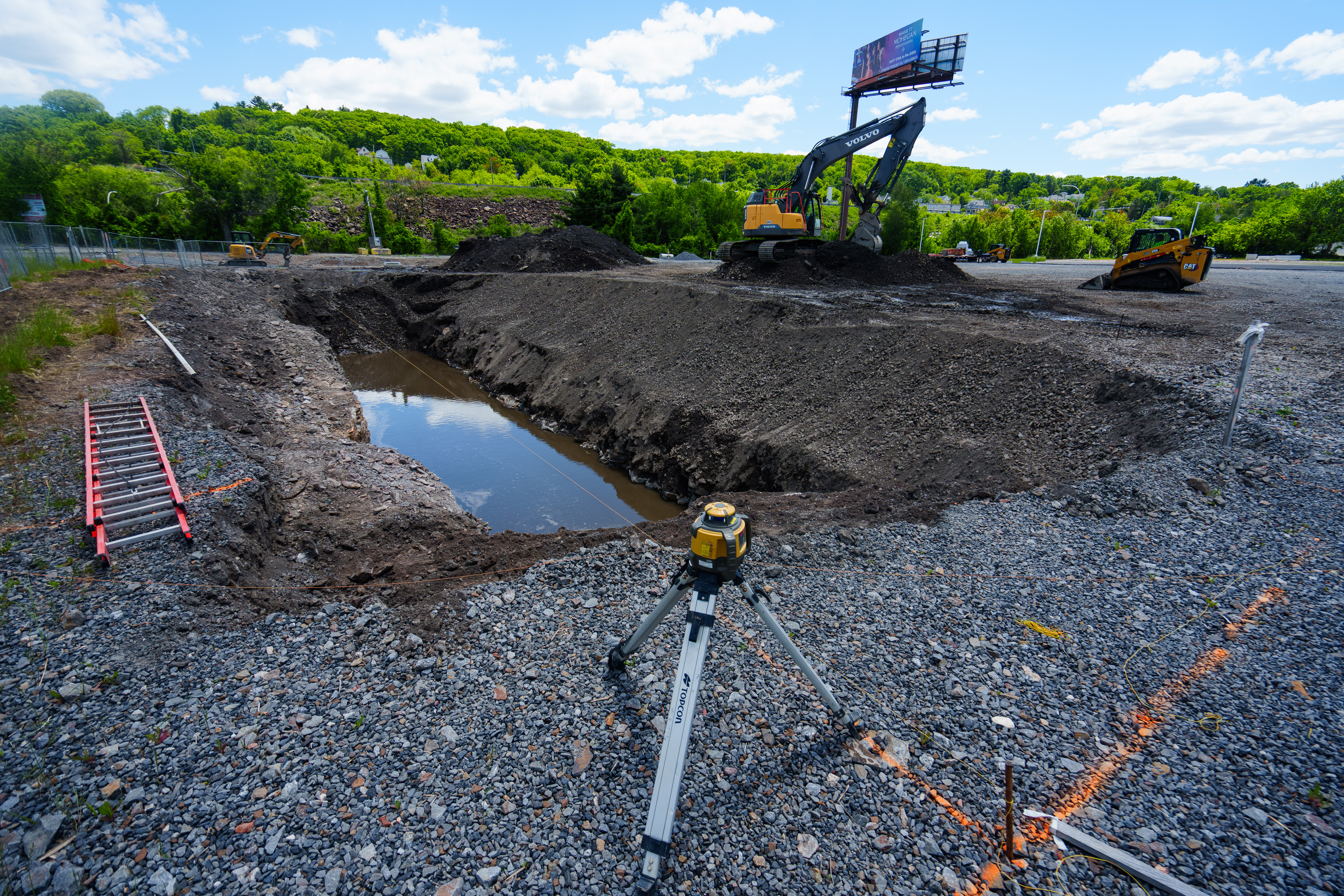 An excavator digs Monday at the site of a Wawa...