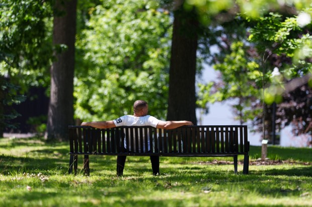 A man sits on a bench in Nay Aug Park in Scranton, Pa., on Tuesday, June 16, 2025. (ISAAC DIAZ/STAFF PHOTO)