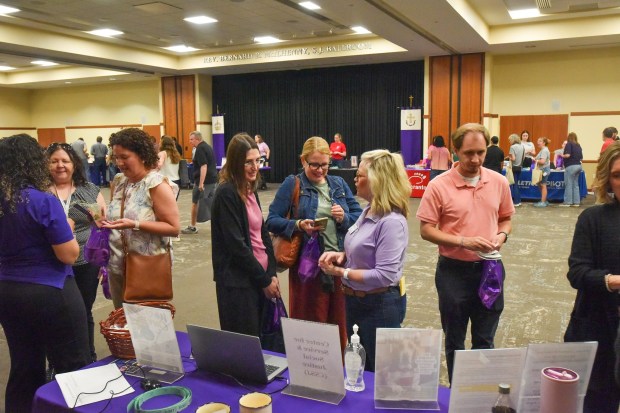 University of Scranton Digital Advertising Manager Georgiana Cocieru and Web Content Strategist Kristin Durkin talk with the school Administrative Assistant for the Center for Service and Social Justice Ellen Judge during the wellness fair in the University of Scranton's DeNaples Center on the Scranton campus Wednesday, June 10, 2026. (SEAN MCKEAG / STAFF PHOTOGRAPHER)