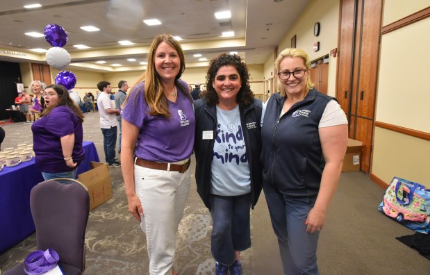 Event organizers, from left, Stephanie Adamec, assistant dean for student wellness, Dina Angeloni, program coordinator for the Center for Health Education and Wellness and Employee Wellness, and Casey Siggia, assistant director for the Center for Health Education and Wellness, gather for a picture during the wellness program for the University of Scranton staff and faculty members in the school's DeNaples Center on the campus in Scranton Wednesday, June 10, 2026. (SEAN MCKEAG / STAFF PHOTOGRAPHER)