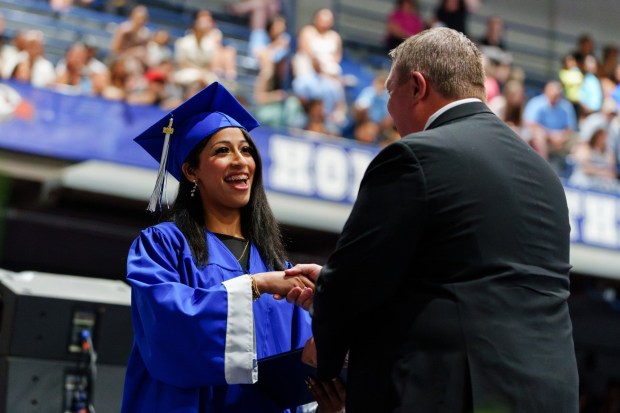A graduate receives her diploma during the West Scranton High School graduation ceremony at the Student Union Gymnasium in Scranton, Pa., on Tuesday, June 9, 2026. (ISAAC DIAZ/STAFF PHOTO)