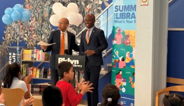 At the Sunset Park Library on Tuesday, Queens Public Library President & CEO Dennis Walcott, left, joined New York City Public Schools Chancellor Kamar Samuels to kick off the citywide “Summer at the Library” reading program. Photo: BPL