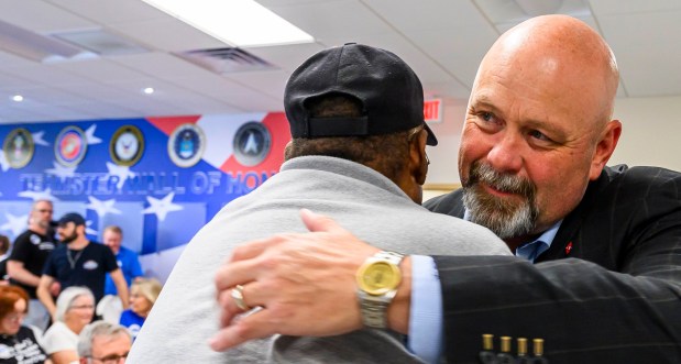 Wallace Lee of Palmer Township speaks with Bob Brooks on June 3, 2026, during a general election kickoff event in Whitehall Township for Bob Brooks' congressional campaign. Brooks, a Democrat and former Bethlehem firefighter, is challenging Republican Rep. Ryan Mackenzie to represent the Lehigh Valley's 7th District. (April Gamiz/The Morning Call)