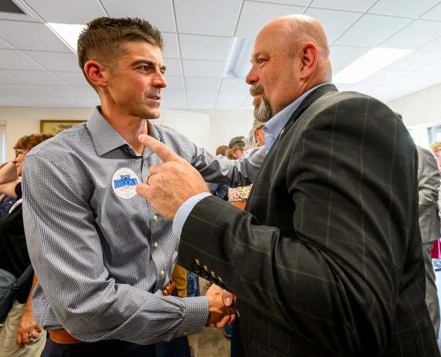 Former candidate Ryan Crosswell shakes hands with Bob Brooks on Wednesday, June 3, 2026, in Whitehall Township during a general election kickoff event for Brooks' congressional campaign. Brooks, a Democrat and former Bethlehem firefighter, is challenging Republican Rep. Ryan Mackenzie to represent the Lehigh Valley's 7th District. (April Gamiz/The Morning Call)