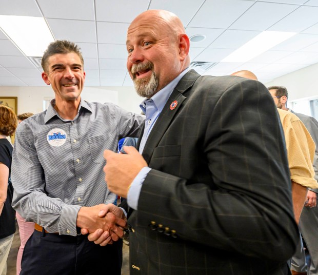 Former candidate Ryan Crosswell shakes hands with Bob Brooks on Wednesday, June 3, 2026, in Whitehall Township during a general election kickoff event for Brooks' congressional campaign. Brooks, a Democrat and former Bethlehem firefighter, is challenging Republican Rep. Ryan Mackenzie to represent the Lehigh Valley's 7th District. (April Gamiz/The Morning Call)