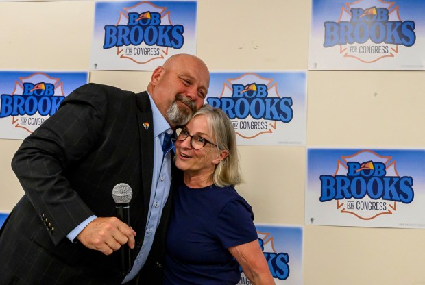 Bob Brooks and Former U.S. Rep. Susan Wild, D-7th District hug Wednesday, June 3, 2026, in Whitehall Township during a general election kickoff event for his congressional campaign. Brooks, a Democrat and former Bethlehem firefighter, is challenging Republican Rep. Ryan Mackenzie to represent the Lehigh Valley's 7th District. (April Gamiz/The Morning Call)