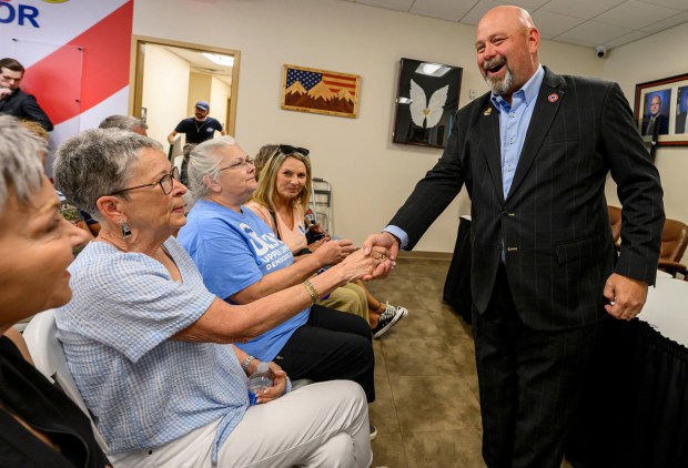 Bob Brooks greets people Wednesday, June 3, 2026, in Whitehall Township during a general election kickoff event for his congressional campaign. Brooks, a Democrat and former Bethlehem firefighter, is challenging Republican Rep. Ryan Mackenzie to represent the Lehigh Valley's 7th District. (April Gamiz/The Morning Call)