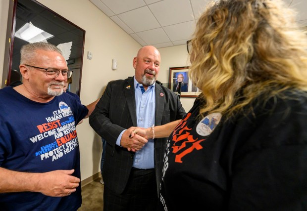 David Christian of Allentown and April Hunter of Bethlehem meet Bob Brooks after he spoke Wednesday, June 3, 2026, in Whitehall Township during a general election kickoff event for his congressional campaign. Brooks, a Democrat and former Bethlehem firefighter, is challenging Republican Rep. Ryan Mackenzie to represent the Lehigh Valley's 7th District. (April Gamiz/The Morning Call)