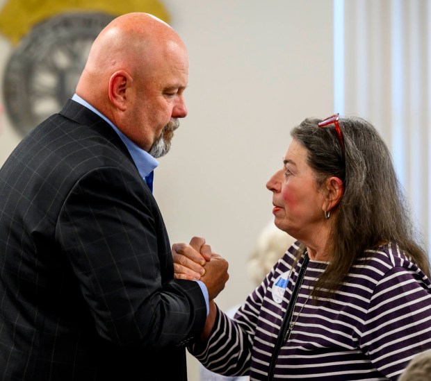 Bob Brooks listens to Palmerton Area Democratic Committee president Sarina Barlow on Wednesday, June 3, 2026, in Whitehall Township during a general election kickoff event for his congressional campaign. Brooks, a Democrat and former Bethlehem firefighter, is challenging Republican Rep. Ryan Mackenzie to represent the Lehigh Valley's 7th District. pose for a picture Wednesday, June 3, 2026, in Whitehall Township during a general election kickoff event for Bob Brooks' congressional campaign. Brooks, a Democrat and former Bethlehem firefighter, is challenging Republican Rep. Ryan Mackenzie to represent the Lehigh Valley's 7th District. (April Gamiz/The Morning Call)