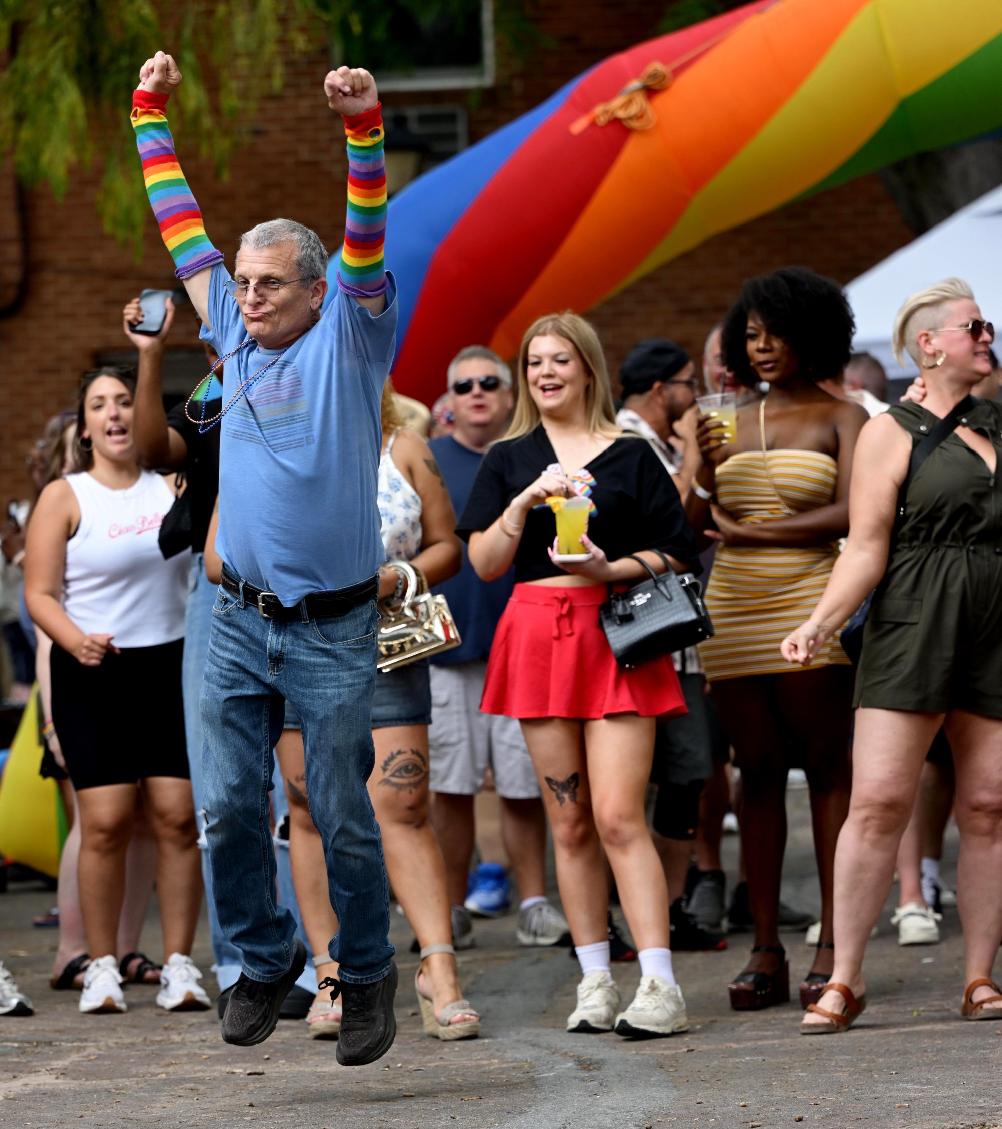 Attendees enjoy themselves Sunday, June 14, 2026, during the walk on the catwalk contest, at the Annual Pride Party Palooza event at the Sun Inn Courtyard in Bethlehem. The afternoon event featured drag performances, music by DJ Brad Scott, vendors, and interactive entertainment. The Pride Party Palooza benefits the Eastern Pa Trans Equity Project. (Monica Cabrera/The Morning Call)