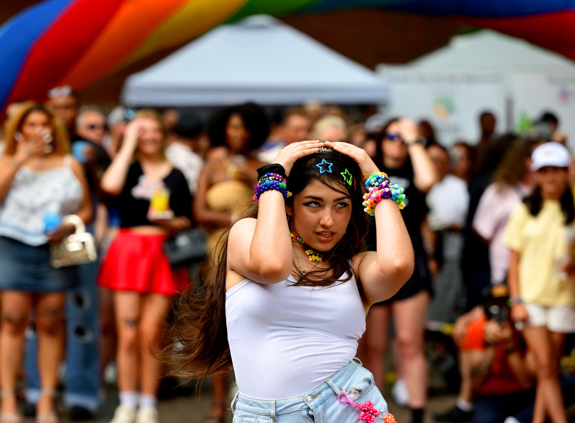 Attendees enjoy themselves Sunday, June 14, 2026, during the walk on the catwalk contest, at the Annual Pride Party Palooza event at the Sun Inn Courtyard in Bethlehem. The afternoon event featured drag performances, music by DJ Brad Scott, vendors, and interactive entertainment. The Pride Party Palooza benefits the Eastern Pa Trans Equity Project. (Monica Cabrera/The Morning Call)