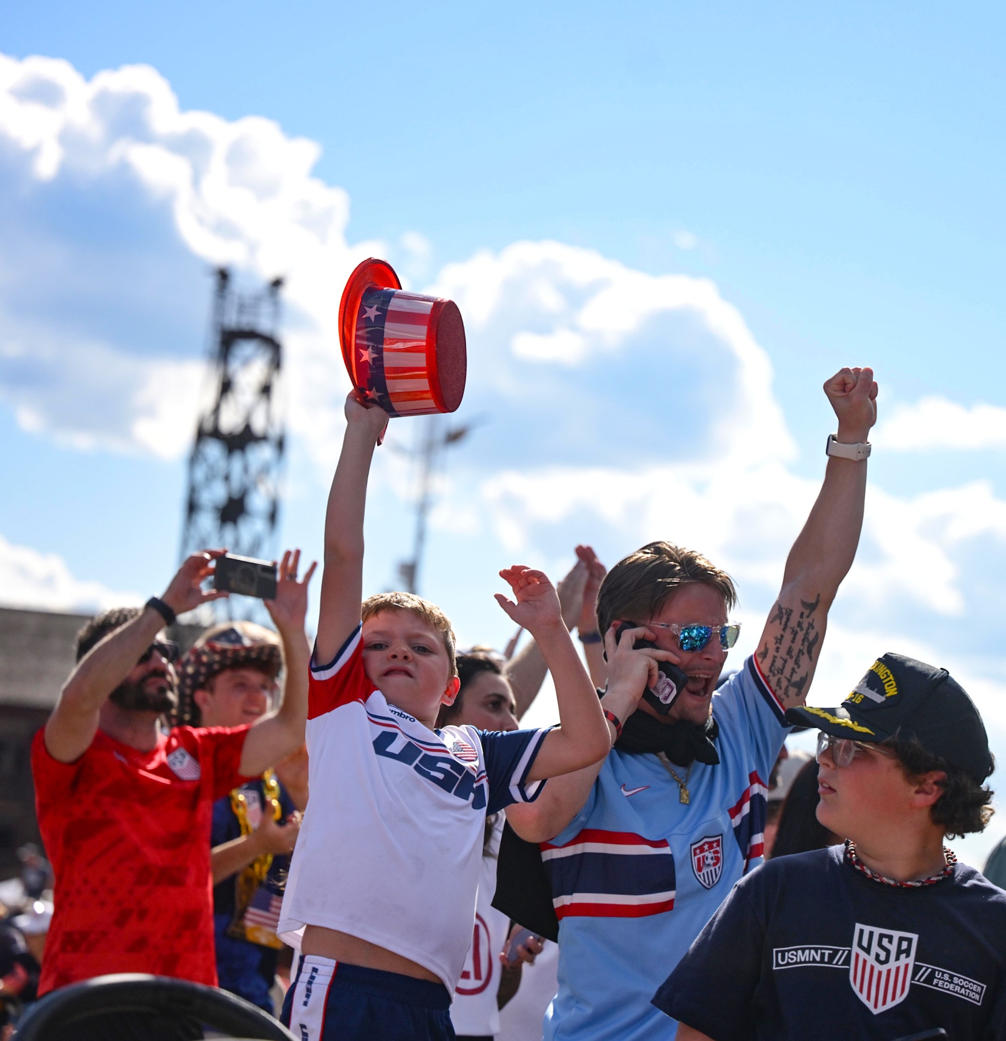 Conner Bullen, 6, of Bethlehem, holds his hat up high on Friday, June 19, 2026, after he watches the United States defeat Australia 2-0 to reach World Cup knockouts at the Lehigh Valley SoccerFest and Viewing Party at SteelStacks in Bethlehem. (Monica Cabrera/The Morning Call)