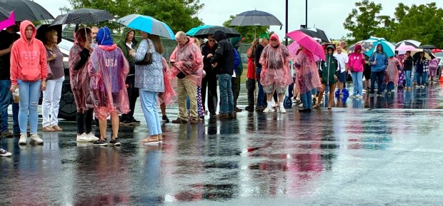 People line up in the rain Tuesday, June 23, 2026, to get into the Mack Truck plant in Lower Macungie Township to see President Donald Trump speak. (April Gamiz/The Morning Call)