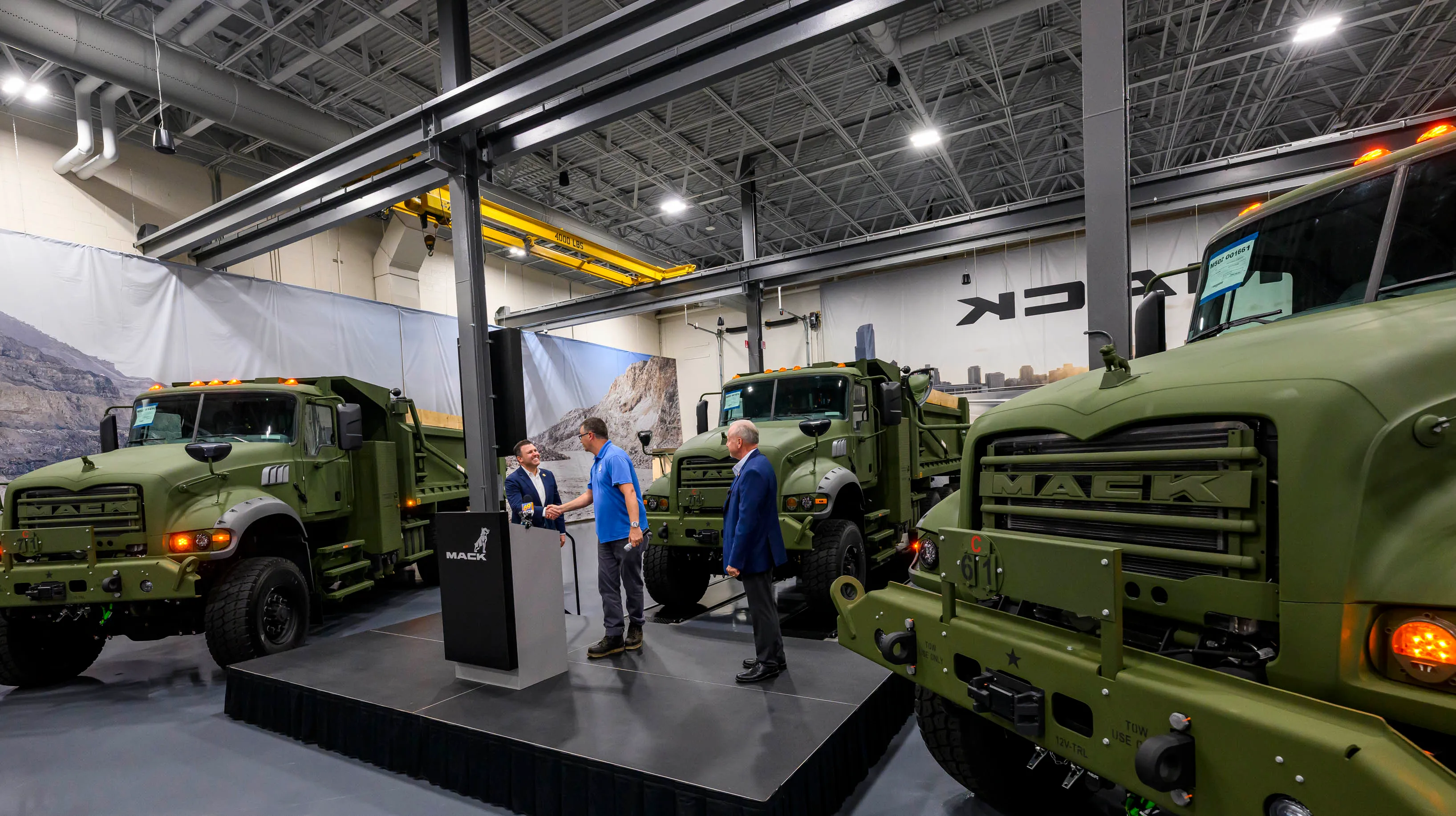 U.S. Rep. Ryan Makenzie shakes UAW representative Tim Hertzogâs hand...