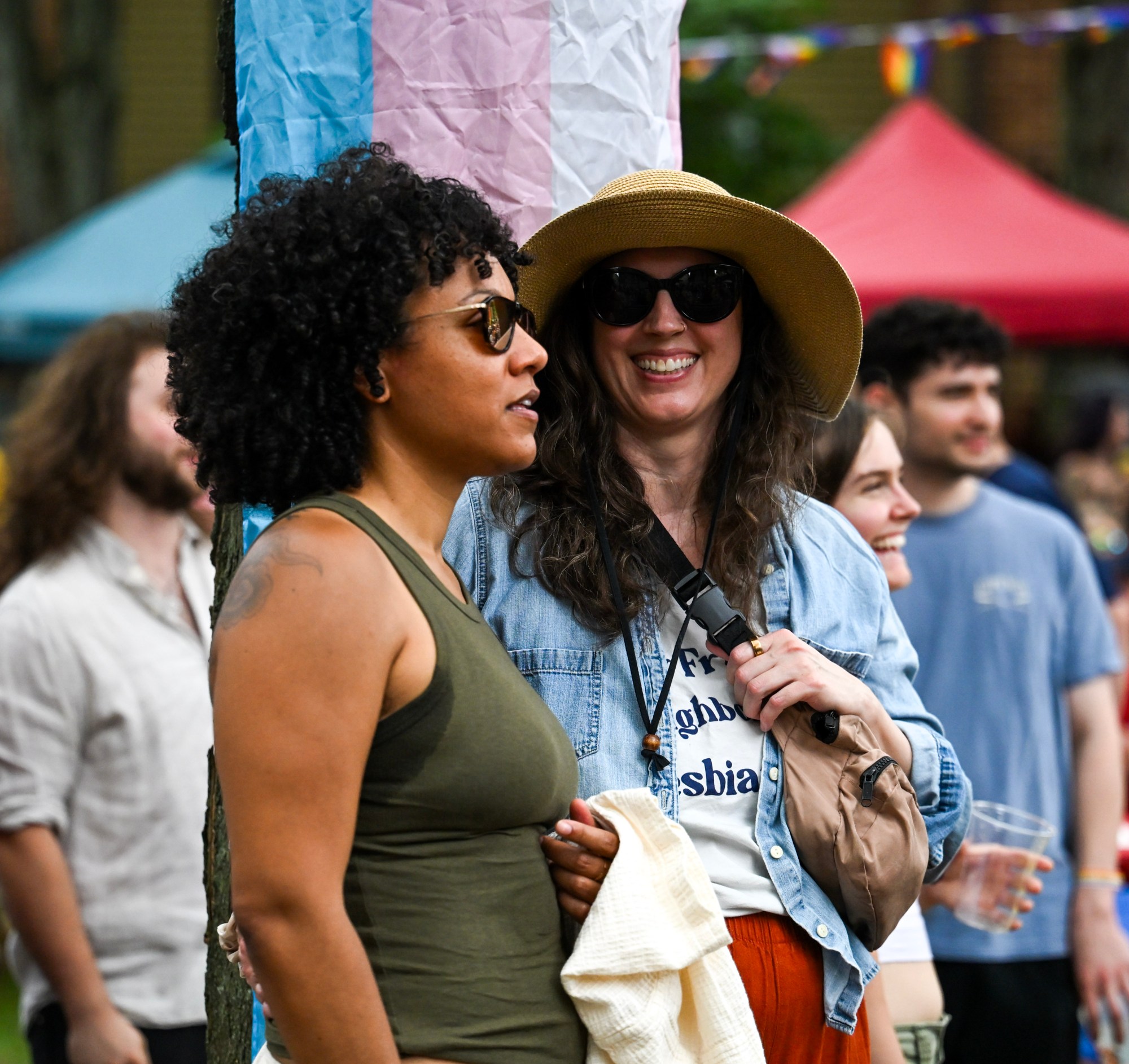 Sarah Kirk and Colleen Martell lean against a tree together Sunday, June 14, 2026, at the Pride Party Palooza in Bethlehem. (Avery Folmar/The Morning Call)