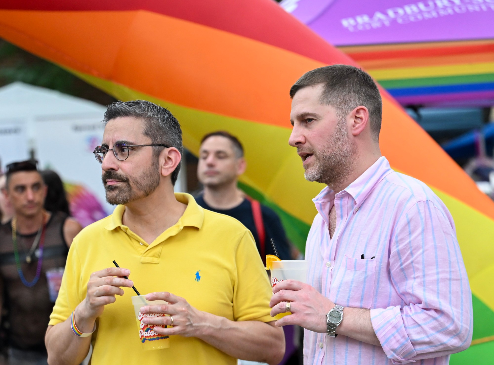 John Christiana and Adam Ballek enjoy a drink Sunday, June 14, 2026, at the Pride Party Palooza in Bethlehem. (Avery Folmar/The Morning Call)
