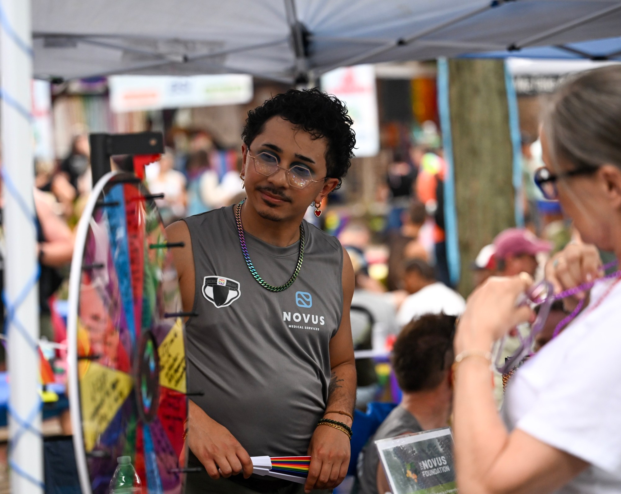 Nate Rosario talks with a customer Sunday, June 14, 2026, at the Pride Party Palooza in Bethlehem. (Avery Folmar/The Morning Call)