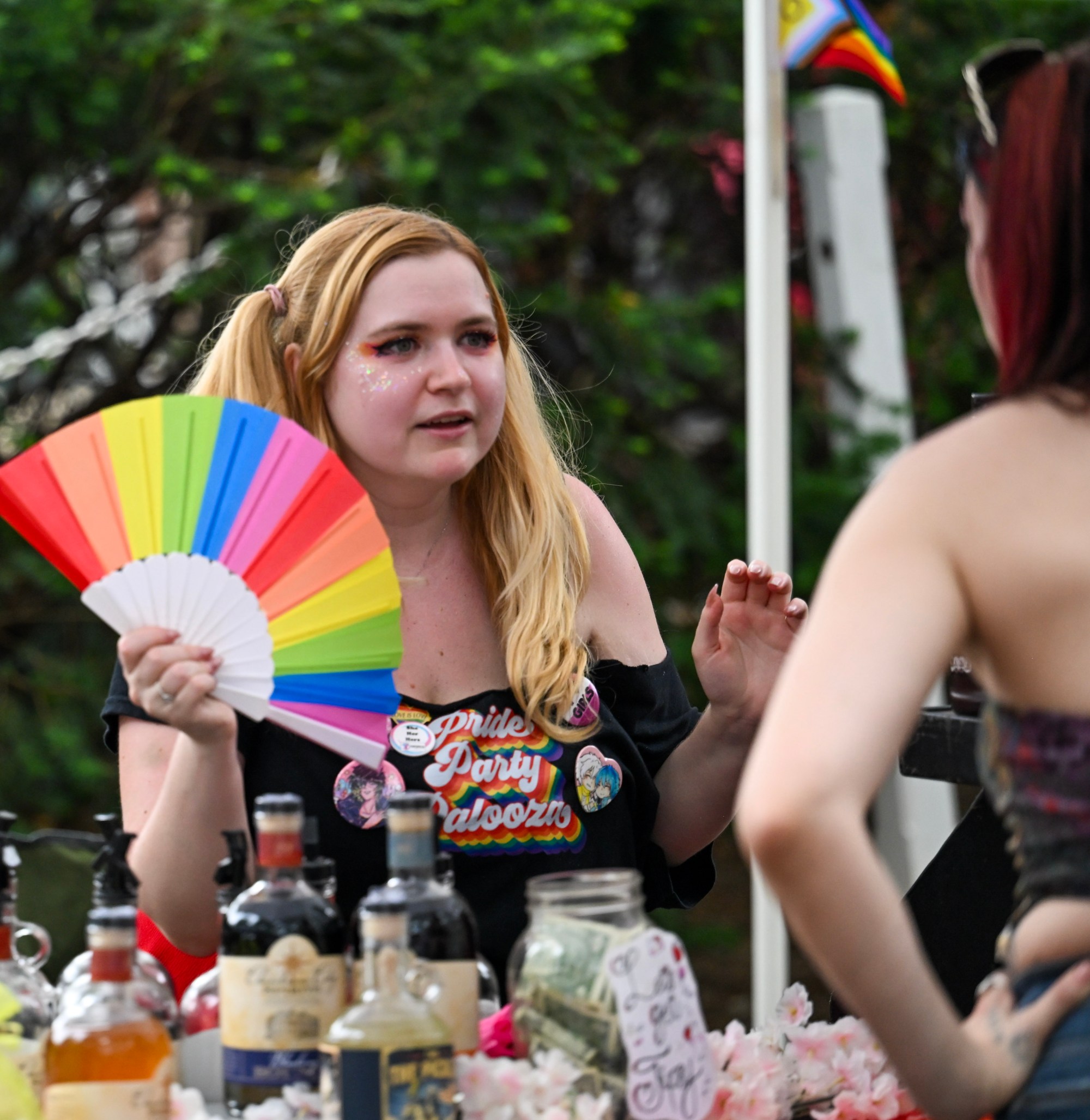 Destinee Schulz talks with a customer Sunday, June 14, 2026, at the Pride Party Palooza in Bethlehem. (Avery Folmar/The Morning Call)