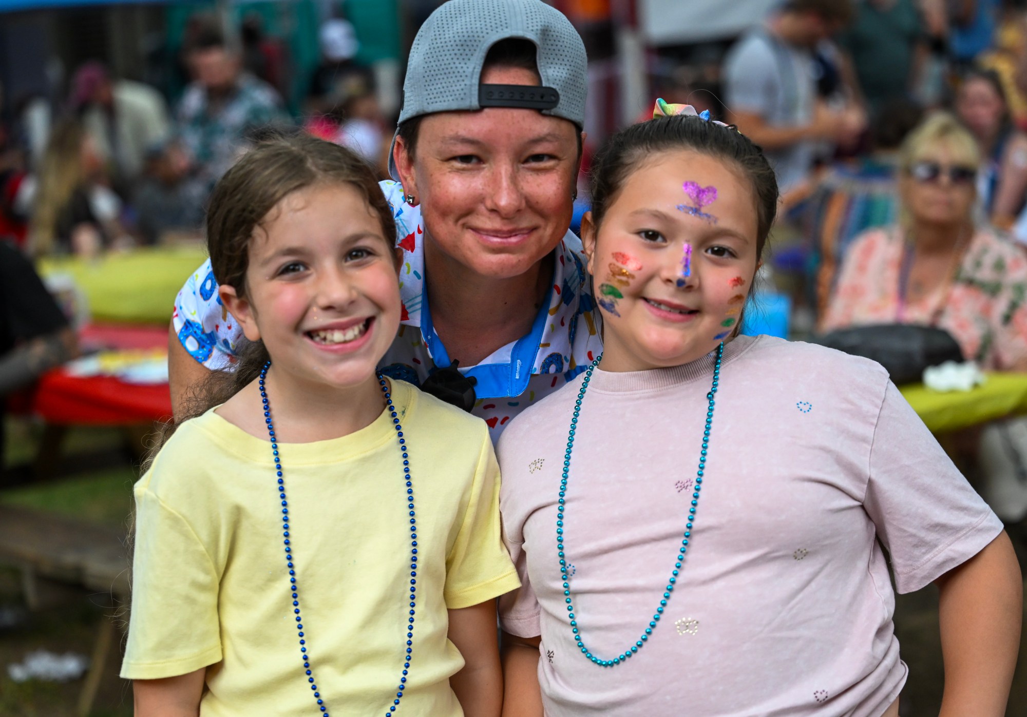 Amira Boudarghal, Kessly Elliot, and Jess Elliott smile Sunday, June 14, 2026, at the Pride Party Palooza in Bethlehem. (Avery Folmar/The Morning Call)