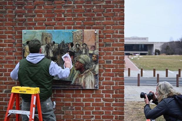 FILE - Panels that were part of an exhibit on slavery at the President's House Site in Philadelphia are put back Thursday, Feb. 19, 2026. (AP Photo/Joe Lamberti, File)