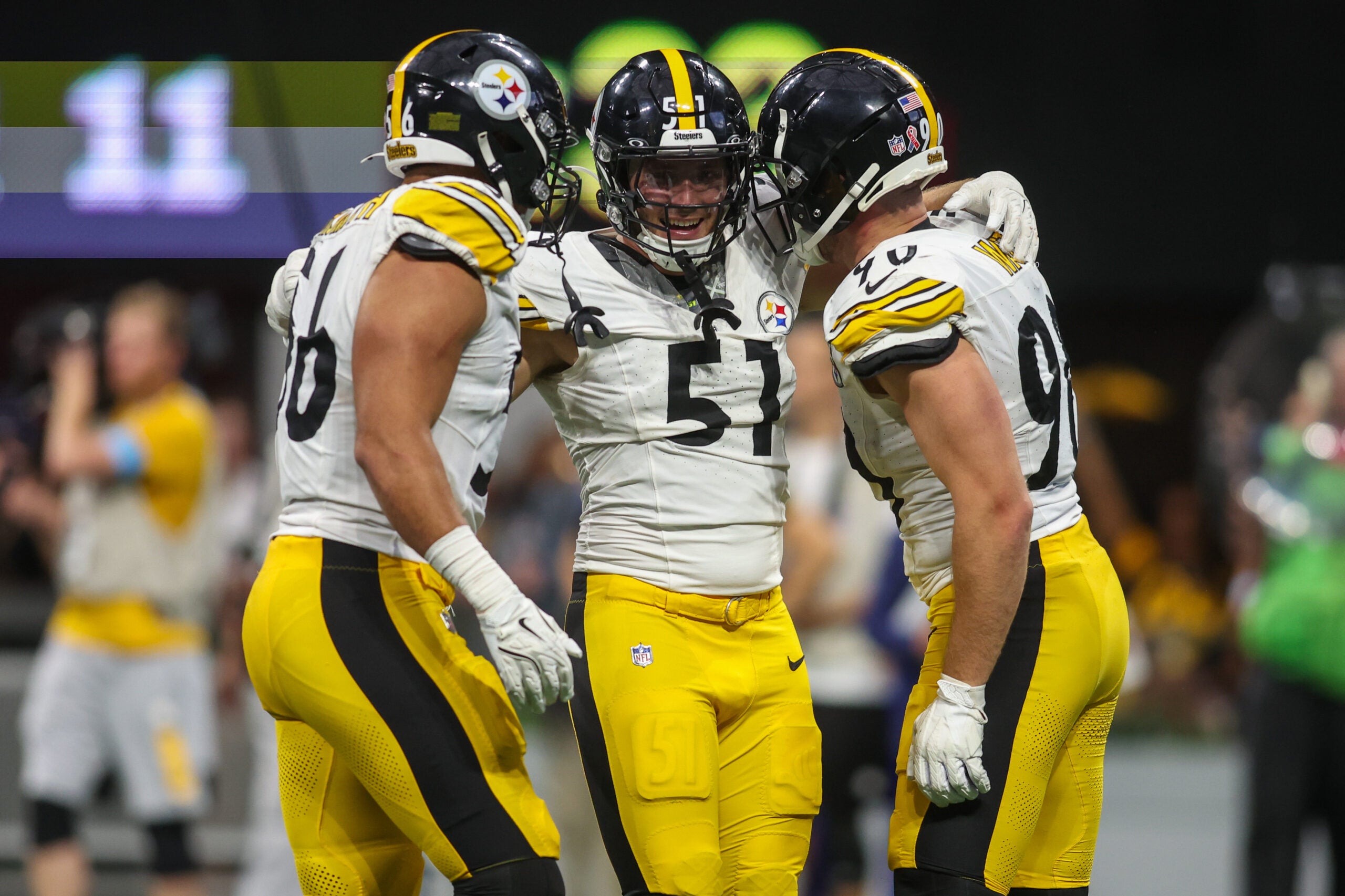 Sep 8, 2024; Atlanta, Georgia, USA; Pittsburgh Steelers linebacker Alex Highsmith (56) and linebacker Nick Herbig (51) and linebacker T.J. Watt (90) celebrate after a victory against the Atlanta Falcons at Mercedes-Benz Stadium.