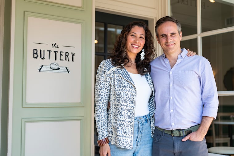 Silenia Rhoads (left) and John Rhoads (right), owners of The Buttery, stand for a portrait in front of their new location in Bryn Mawr on Wednesday, June 17, 2026.