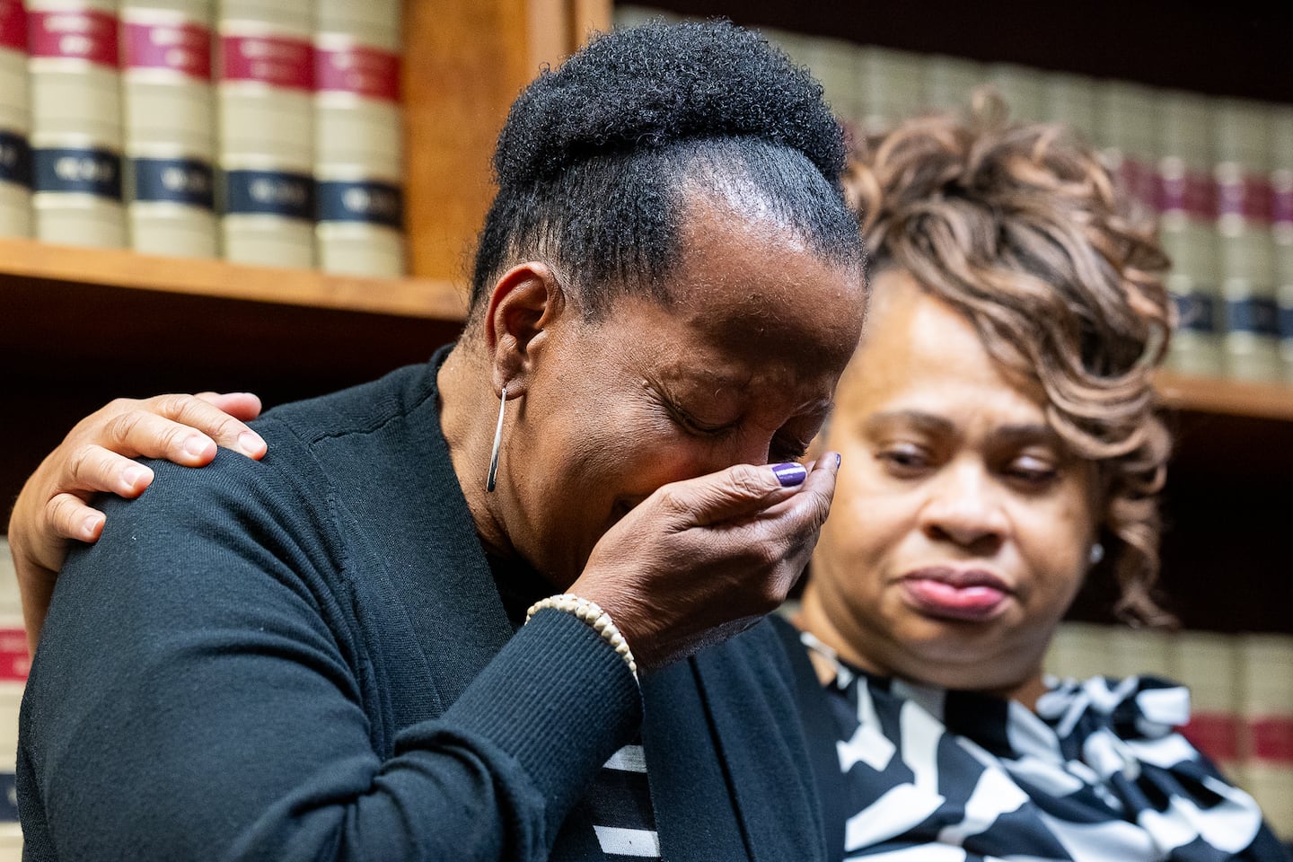 Janet Bradley-Knight was comforted by Shakirah Wiggins during a press conference to announce the identity of their relative, Tiffany Bradley, as the unidentified person found murdered nearly 26 years ago.