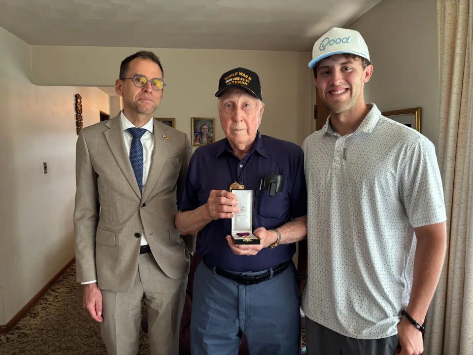 Belgium’s Consul General Filip Vanden Bulcke presents Truman Christian with the Order of Leopold on Wednesday, June 11, 2026, in Cumberland County, Pennsylvania. Tyler Boland, who documents the lives of WWII veterans, helped arrange with the consulate.