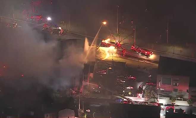 a massive building fire in allentown has knocked out power to thousands of residents.