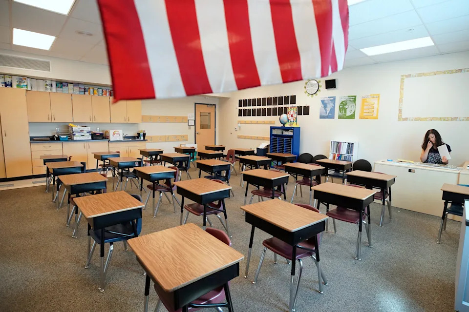 A teacher awaits students to come into the classroom. George Frey/Getty Images