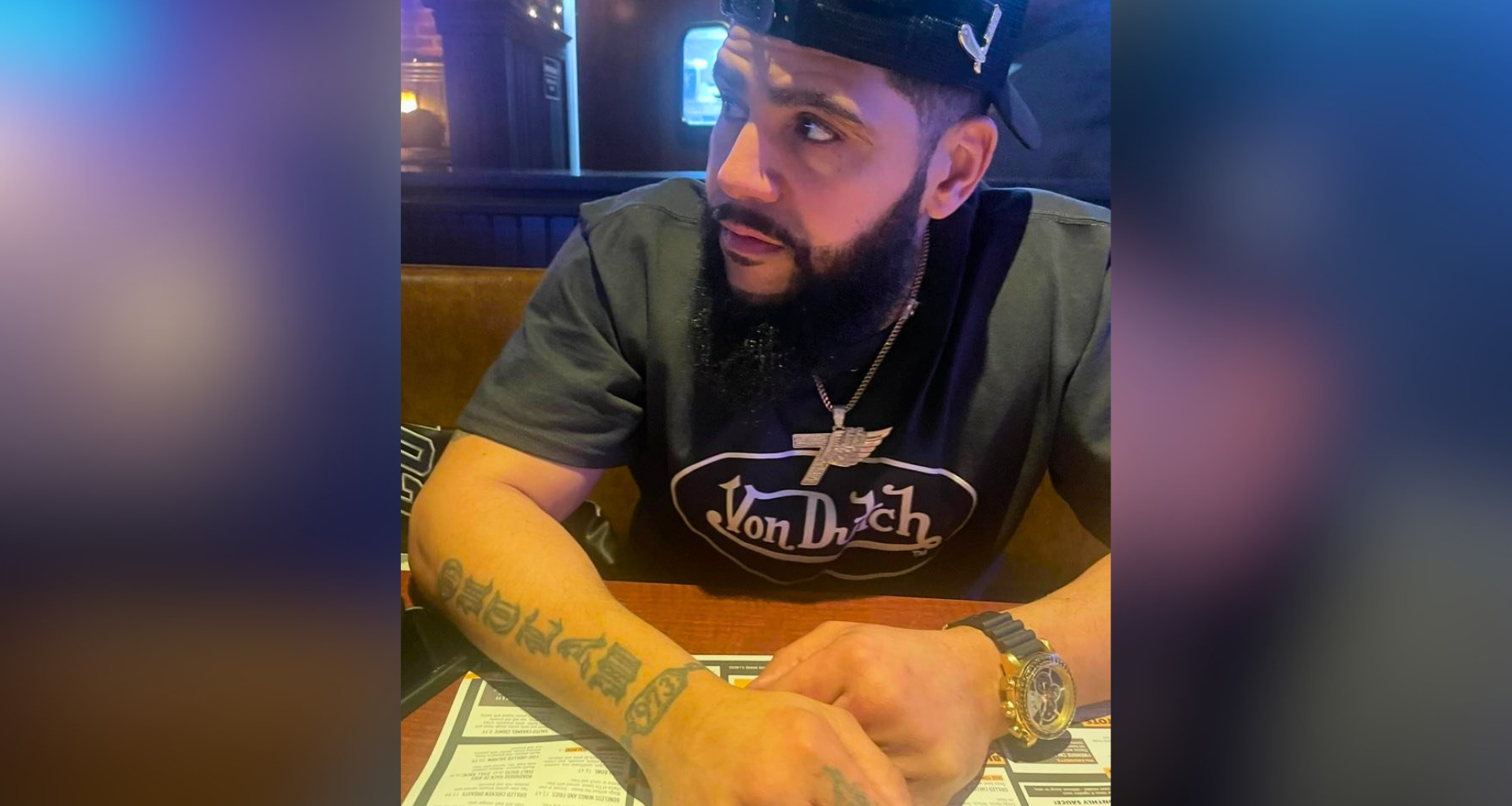 Carlos Figueroa, whom Bethlehem police say is wanted in connection with a June 3 domestic violence incident, seated at a table.