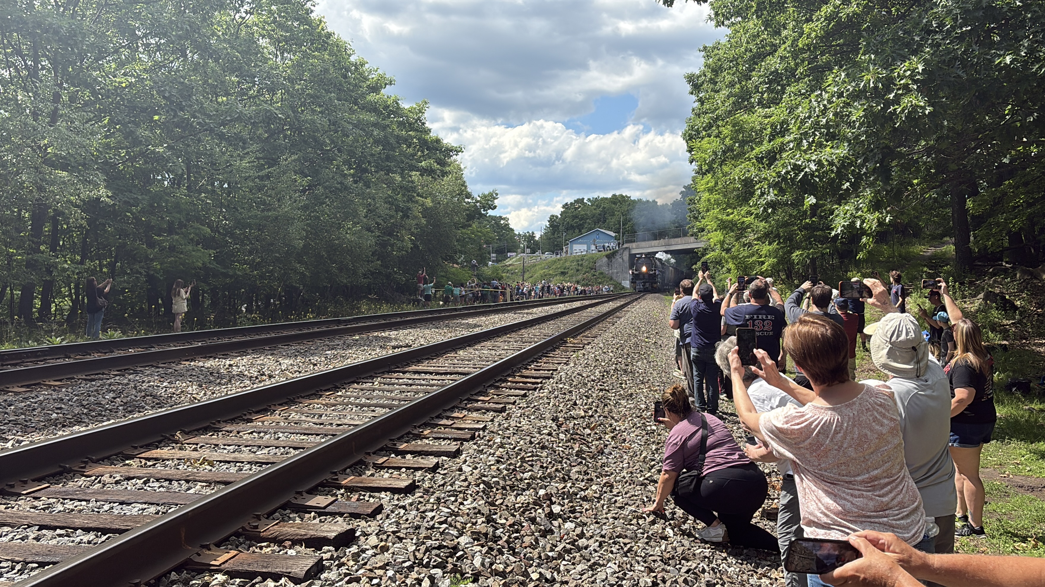 The Big Boy 4014 locomotive approaches a group of spectators...