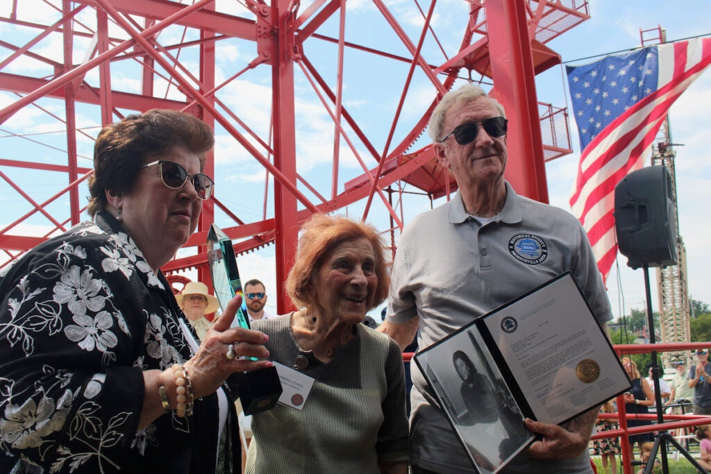A woman is given an award for her role in restoring a ferris wheel in Phoenixville, Pennsylvania