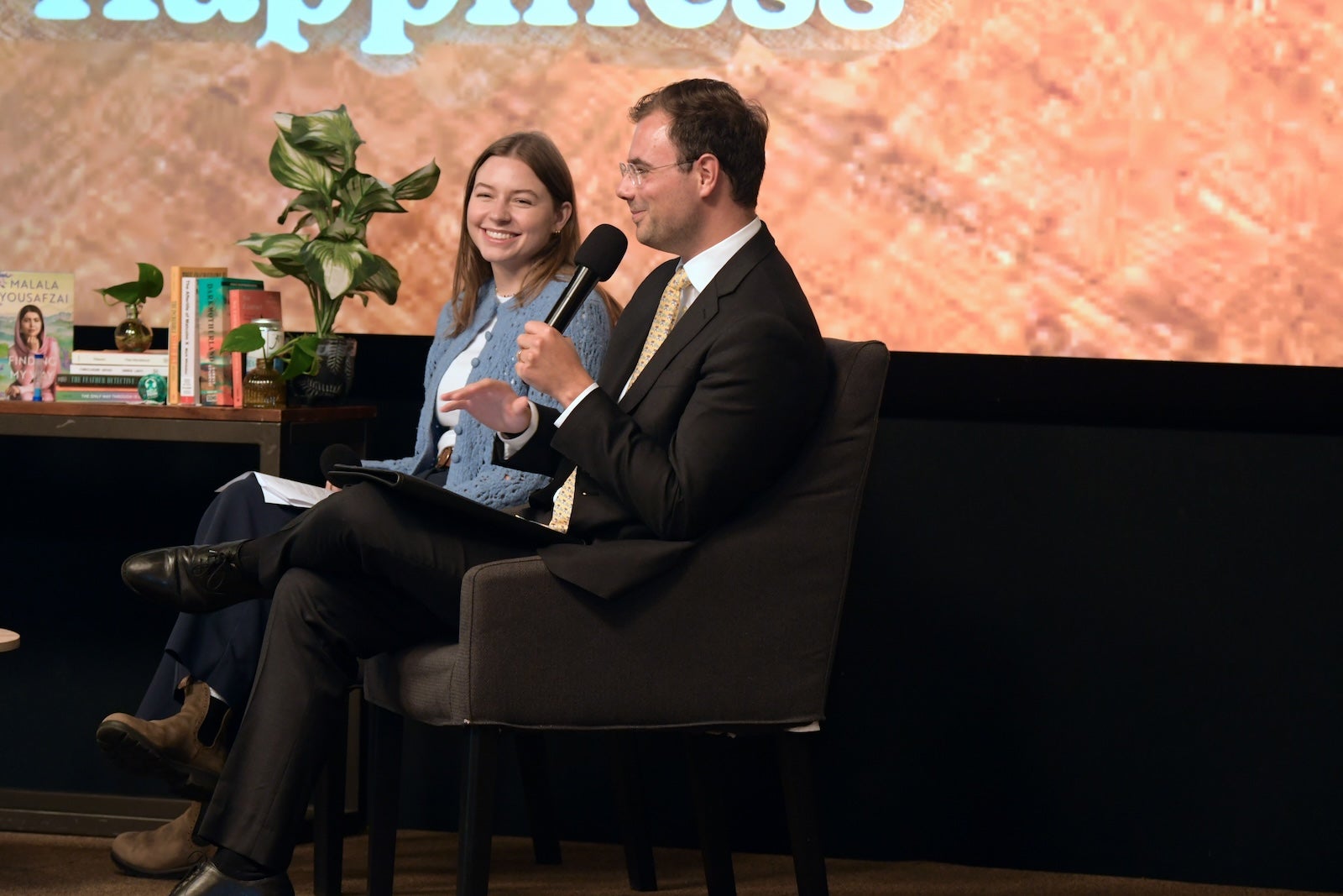 Amanda Moore, Amanda Moore, program director of Drexel University's Happiness Lab, and Peter Jakob Olsen-Harbich, associate director of the McNeil Center for Early American Studies at the University of Pennsylvania, speak at WHYY headquarters.