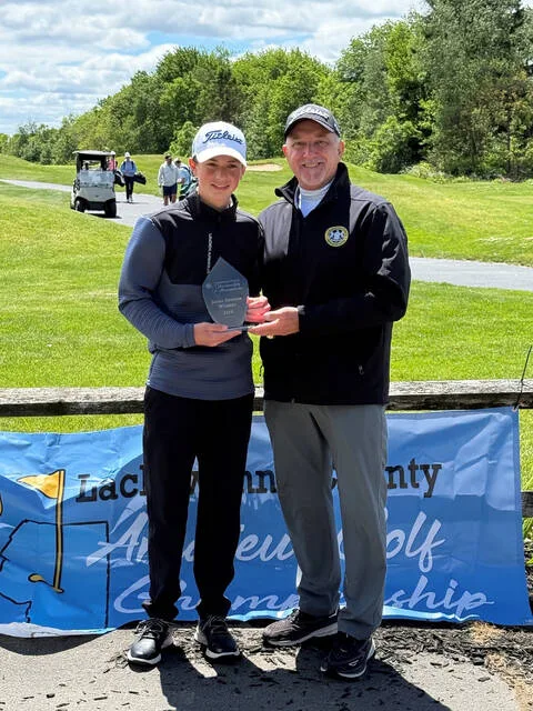 <p>Adam Holman of West Scranton High School shot a one-under par 70 to win the Lackawanna County Boys Junior Division Amateur Golf Tournament in late May at Pine Hills Country Club, Taylor. From left: Holman and Mark Cordelli, the tourney director, who presented the award.</p>
<p>Submitted Photo</p>
