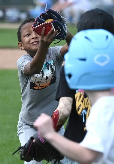 <p>Wyoming Area baseball camper Cairo Garretson, 6, makes a tough catch in the outfield on Wednesday.</p>
<p>Tony Callaio | For Sunday Dispatch</p>