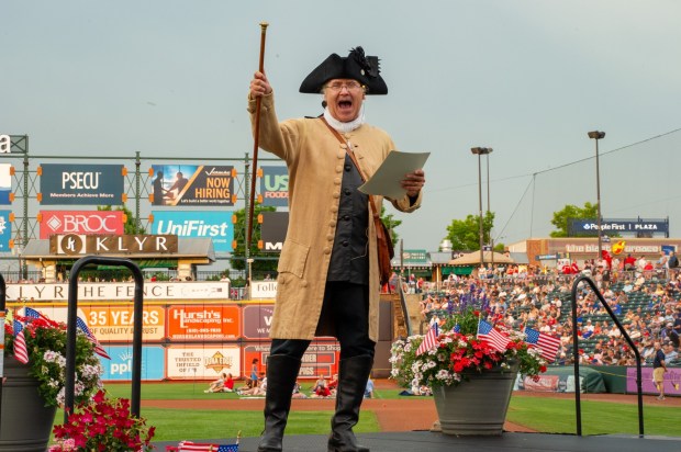 Members of the Bachmann Players perform as a town crier, Benjamin Franklin reads the Declaration of Independence, and Colonial soldiers present a musket salute Friday, July 3, 2026, during the Liberty Ignited celebration marking America's 250th birthday at Coca-Cola Park in Allentown. (Jonathan Broady/Special to The Morning Call)