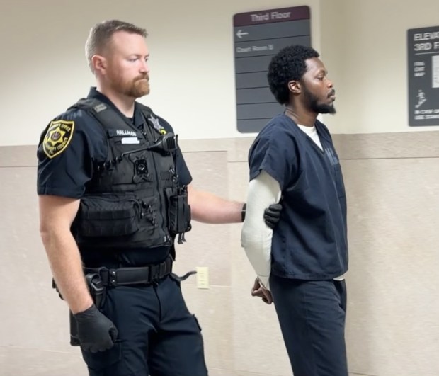 Nafis Lloyd-Allen is taken into custody by a deputy sheriff to begin prison term for illegal gun possession. (Photo by Carl Hessler Jr. - MediaNews Group)