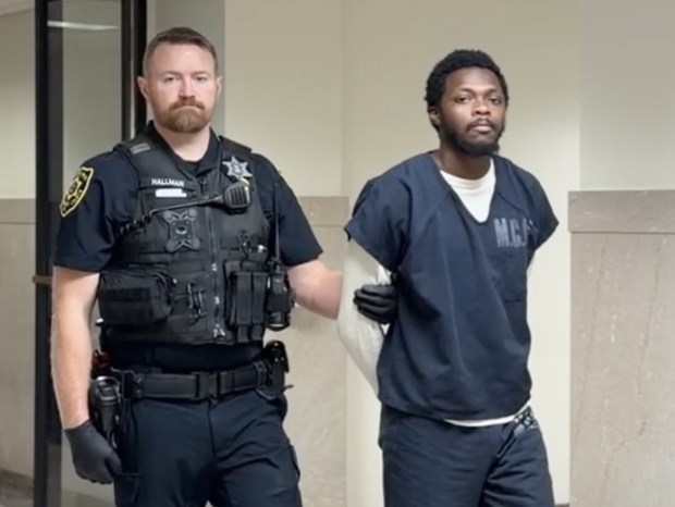 Nafis Lloyd-Allen is escorted from a Montgomery County courtroom by a deputy sheriff to begin 6-12 year prison term. (Photo by Carl Hessler Jr. - MediaNews Group)