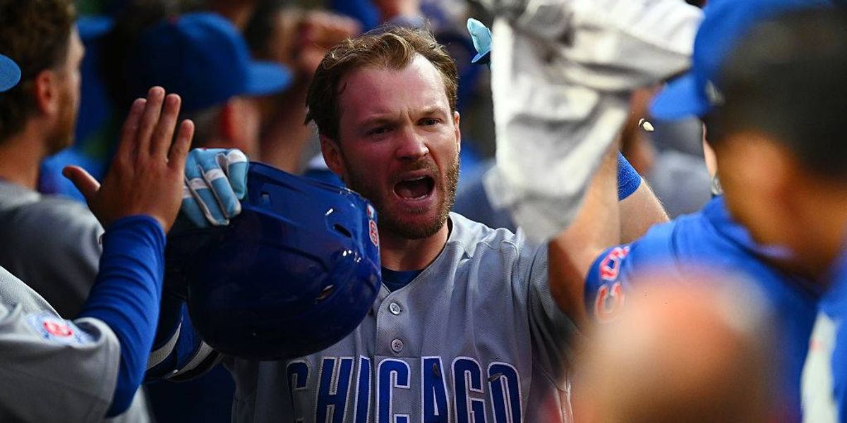 Pittsburgher Happ scores/throws out runner, Cubs beat Bucs