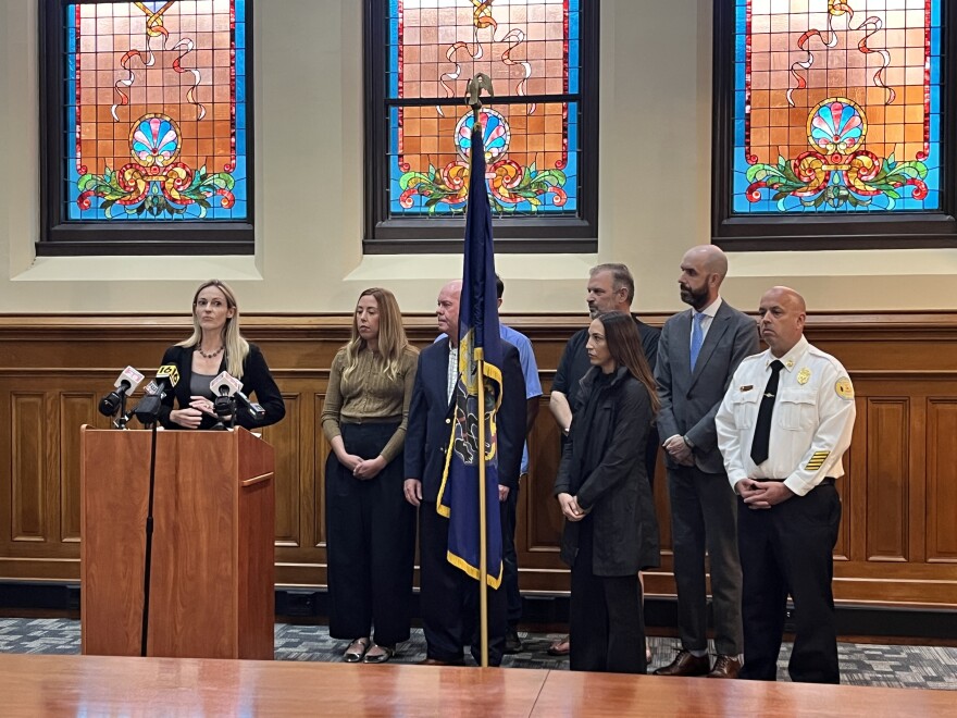 Scranton Mayor Paige Cognetti is joined by city officials, council vice president Patrick Flynn, and downtown business representatives during a press conference.