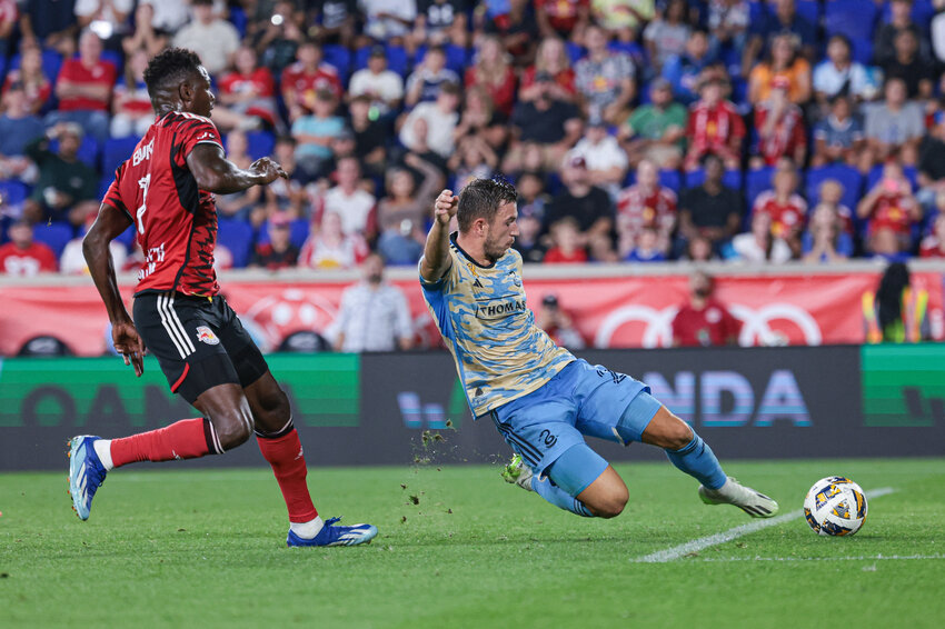 Harrison, New Jersey, USA; Philadelphia Union defender Kai Wagner (27) clears the ball away from New York Red Bulls forward Cory Burke (7) during the second half at Red Bull Arena. Mandatory Credit