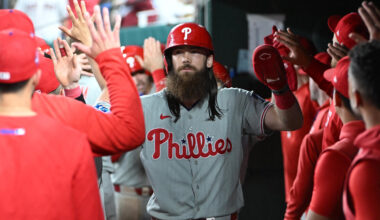 Philadelphia Phillies left fielder Brandon Marsh (16) is congratulated by teammates after scoring a run during the eighth inning at Nationals Park.
