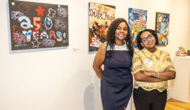 Artist Isabella Hunter and her teacher pose with ​